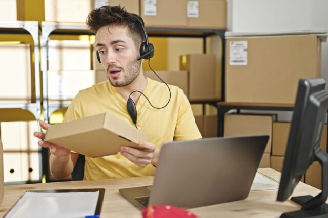 Ecommerce support agent handling order inquiry in small warehouse office